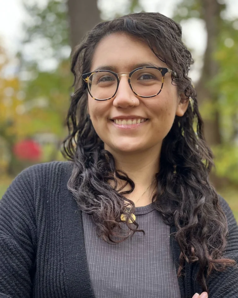 Rachel Scullion, Therapist at SEC LLC, smiling at the camera wearing glasses.