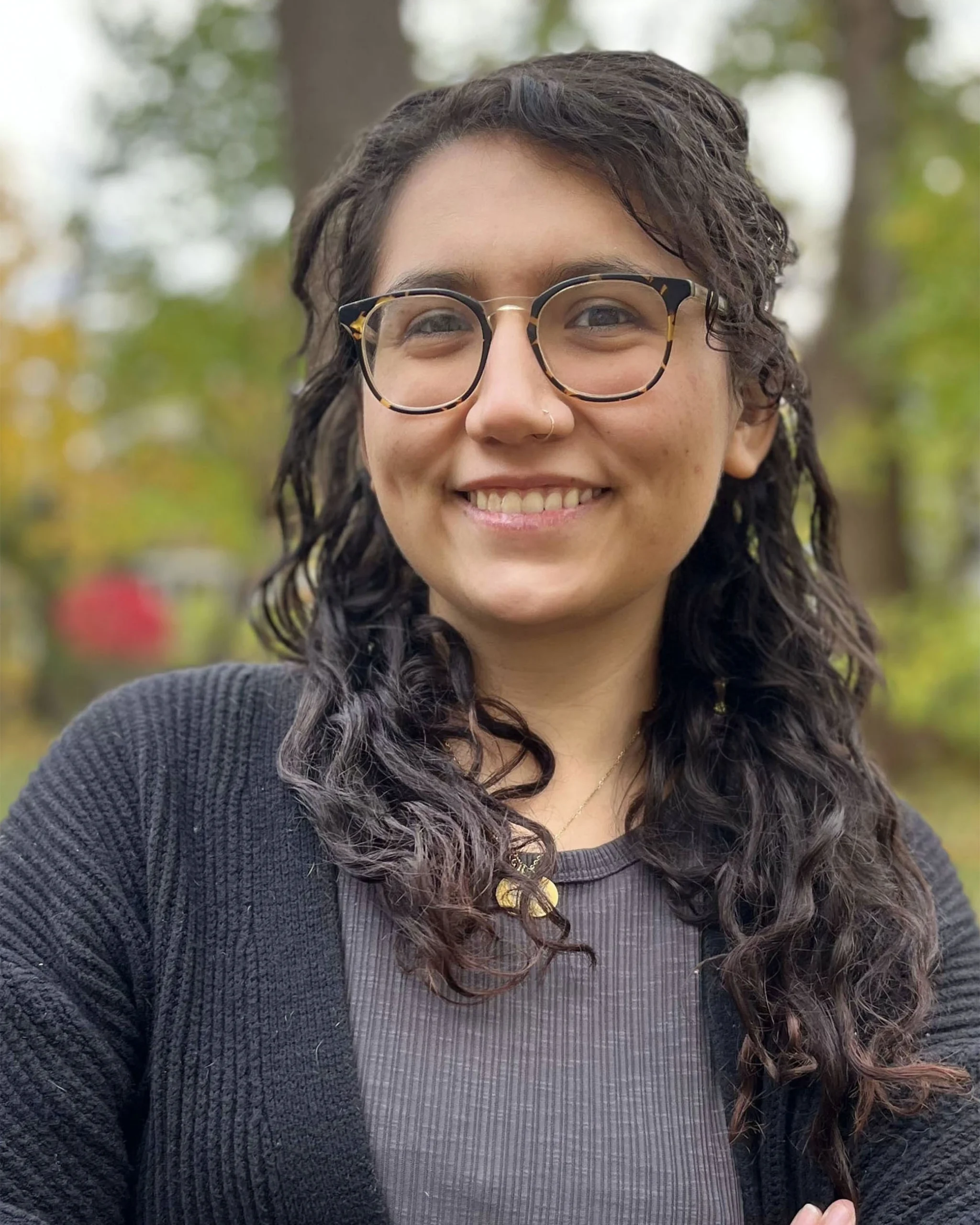 Rachel Scullion, Therapist at SEC LLC, smiling at the camera wearing glasses.