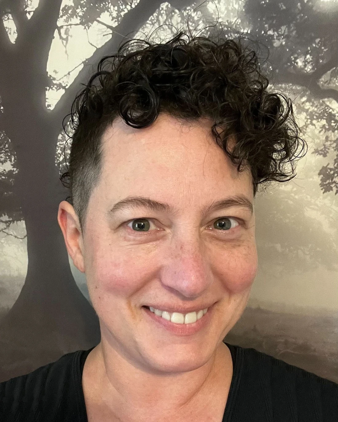 Natty Pearce, Therapist at SEC LLC, smiling at the camera.